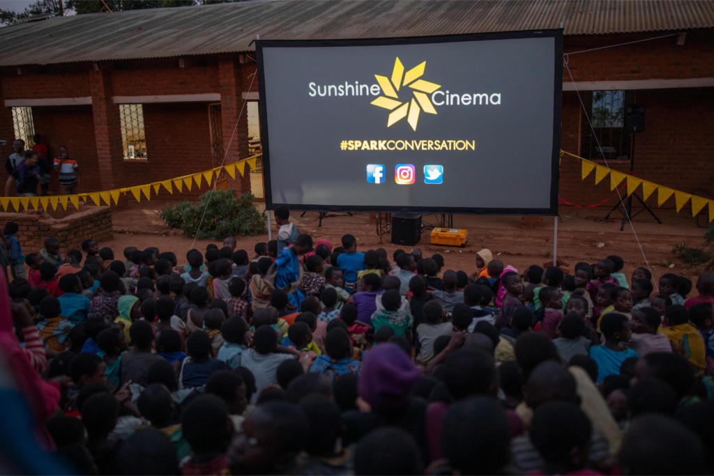 sunshine cinema audience at night. spark conversation